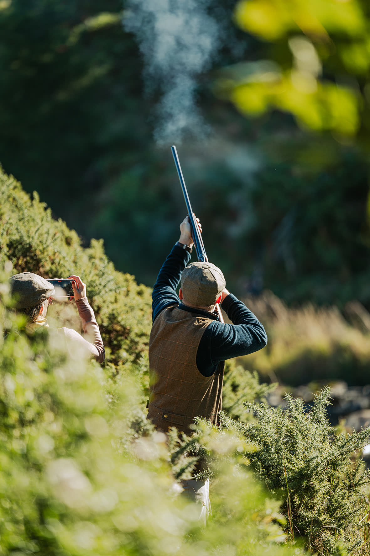 Gundog handler with working dog during shooting party
